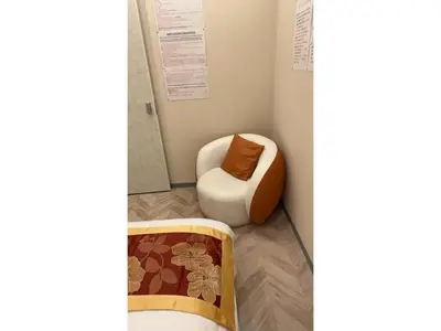 a room with a chair and a ottoman at MIYAVI hotel - Vacation STAY 75575v in Tokyo