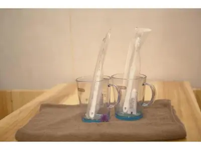 two glasses sitting on top of a table with toothbrushes at MIYAVI hotel - Vacation STAY 75522v in Tokyo