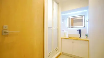 a bathroom with a sink and a mirror at Yuina Hotel Shinjuku in Tokyo