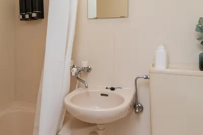 a small bathroom with a sink and a toilet at Frt\u6c60\u888b2\u4e01\u76ee906 in Tokyo