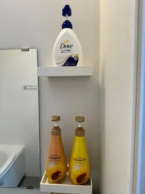 a refrigerator with two bottles of detergent and a jug of milk at Tokyo Stay Top Ikebukuro #203 in Tokyo