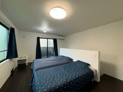 a bedroom with a bed and a window at Tokyo Stay Top Ikebukuro #203 in Tokyo