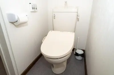 a bathroom with a white toilet in a stall at Y's INN Nakano 016T in Tokyo