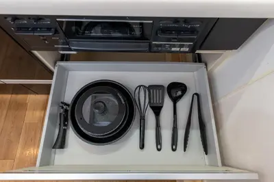 a drawer with utensils inside of a appliance at FINOA Asakusa Sky Terrace in Tokyo