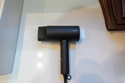 a black flashlight sitting on top of a table at FINOA Asakusa Sky Terrace in Tokyo