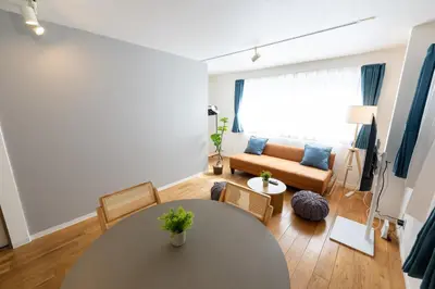 a living room with a table and a couch at FINOA Asakusa Sky Terrace in Tokyo