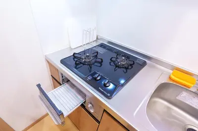 a stove top in a kitchen next to a sink at MINE HOME\u6771\u4e2d\u91ce 116t in Tokyo
