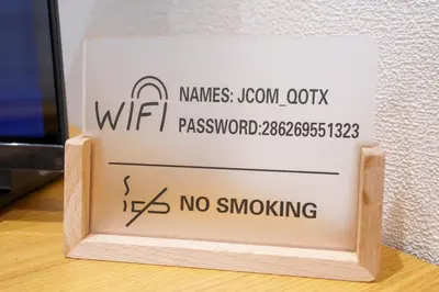 a sign that says no smoking in front of a tv at MINE HOME\u6771\u4e2d\u91ce 116t in Tokyo