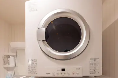 a washing machine with a window in a kitchen at Y's INN アネックス 012T in Tokyo