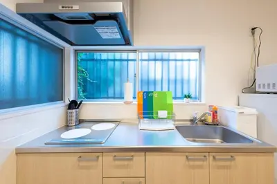 a kitchen counter with a sink and a window at Y's INN アネックス 012T in Tokyo