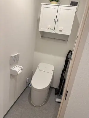 a small bathroom with a toilet and a white cabinet at rd\u6c11\u6cca2F in Tokyo