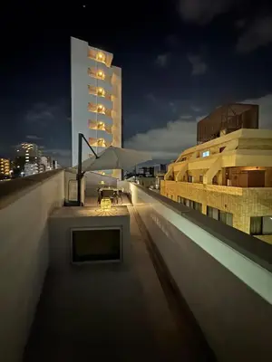 a view from the rooftop of a building at night at DesignAward,Alphinaud in Tokyo