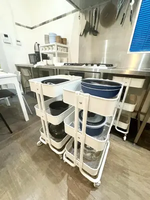 a kitchen with a cart full of dishes at DesignAward,Alphinaud in Tokyo