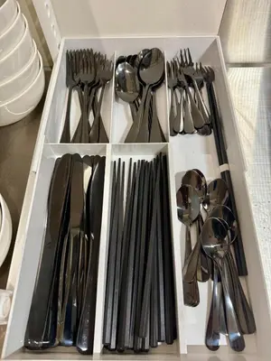 a white drawer filled with utensils and spoons at DesignAward,Alphinaud in Tokyo