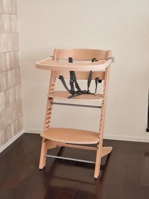 a wooden high chair sitting in a room at Mejiro 501 in Tokyo