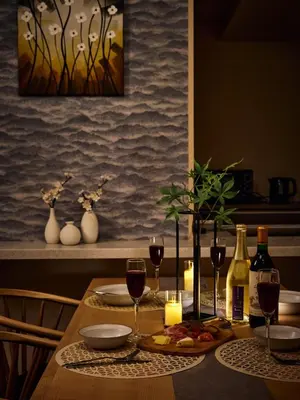 a table with glasses of wine and a plate of food at Mejiro 501 in Tokyo