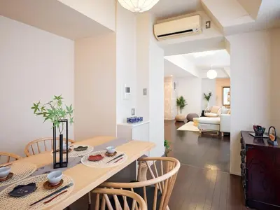 a dining room and living room with a table and chairs at Mejiro 501 in Tokyo