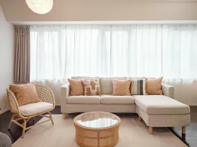 a living room with a couch and two chairs at Mejiro 501 in Tokyo