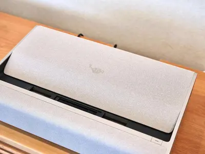 a laptop computer sitting on top of a table at Mejiro 501 in Tokyo