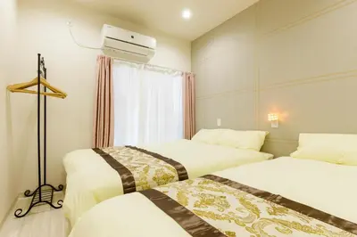 a hotel room with two beds and a window at Y's INN NishiShinjuku 018T in Tokyo