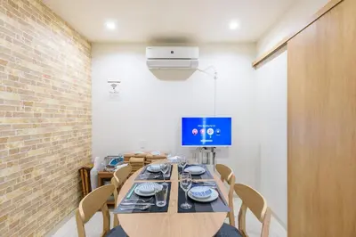 a dining room with a long table and chairs at Y's INN NishiShinjuku 018T in Tokyo