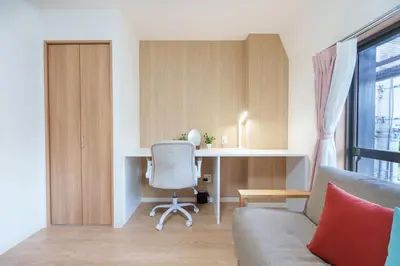 a living room with a desk and a chair at Y's INN Ikefukuro 109T in Tokyo