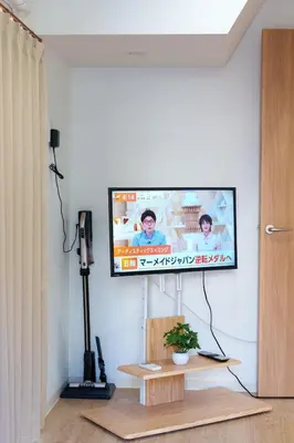 a flat screen tv on a wall in a living room at Y's INN Ikefukuro 109T in Tokyo