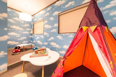 a childs room with a tent and a table at \u697d\u5bbf Itabashi 011T in Tokyo