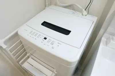 a white machine sitting in a refrigerator at ALDO INN Toyosu in Tokyo