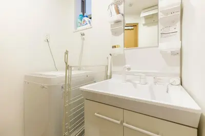a bathroom with a sink and a washing machine at \u697d\u5bbf Nishi Shinjuku 017T in Tokyo