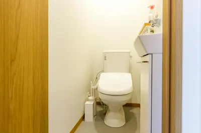 a bathroom with a white toilet in a room at \u697d\u5bbf Nishi Shinjuku 017T in Tokyo