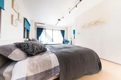 a bedroom with a large bed and a window at Y's INN Koiwa 010T in Tokyo