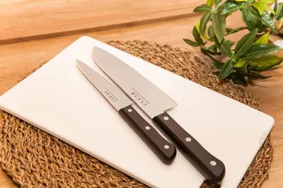 two knives sitting on top of a table at Y's INN Koiwa 010T in Tokyo