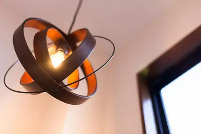 a chandelier with a brown ribbon hanging from a ceiling at Y's INN Koiwa 010T in Tokyo