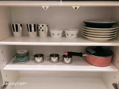 a shelf with dishes and cups and plates on it at Shinjuku 105 in Tokyo