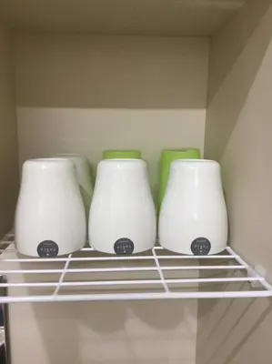 a group of three vases sitting on a shelf at Shinjuku 105 in Tokyo