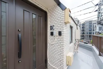 a door on the side of a building with a balcony at \u697d\u9038\u30b0\u30eb\u30fc\u30d7 \u6c60\u888b\u745e\u6708\u82d13F 111Tc in Tokyo
