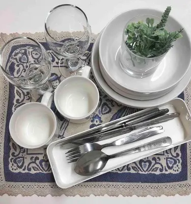 a table with plates and silverware on a table at Shinjuku 102 in Tokyo