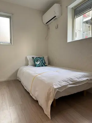 a bedroom with a large bed with a window at Asakusa\u5708\u99c5\u304b\u30898\u5206\u65e5\u5f0f\u72ec\u680b\u522b\u5885 in Tokyo