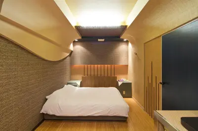 a bedroom with a white bed in a room at International Hotel Kabukicho in Tokyo