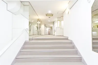 a hallway with stairs in a building at Shinjuku East Hotel in Tokyo