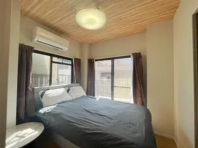 a small bedroom with a bed and a window at \u677e\u5c4b Hotel in Tokyo