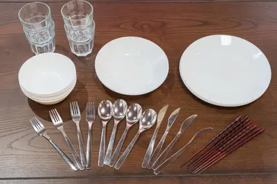 a table with white plates and forks and glasses at Tokyo Ninja \u5c4b\u6577 in Tokyo