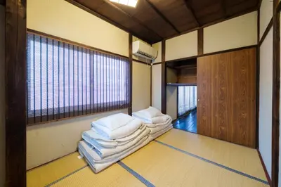 a room with three stacks of towels on the floor at Tokyo Ninja \u5c4b\u6577 in Tokyo