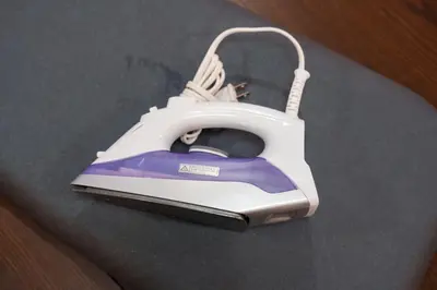 a iron is sitting on top of a table at Tokyo Ninja \u5c4b\u6577 in Tokyo