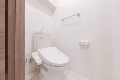 a bathroom with a white toilet with a remote control at House hotel EKODA 1F 3F HE1131 in Tokyo