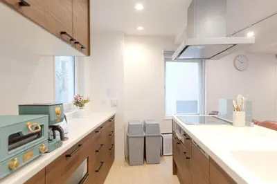a kitchen with a sink and a stove top oven at Jessica House in Tokyo