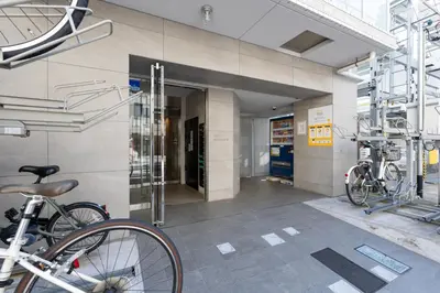 a building with two bikes parked outside of it at LIVCITY Kinshicho 302 in Tokyo