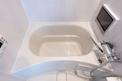 a white bath tub in a bathroom with a sink at LIVCITY Kinshicho 402 in Tokyo