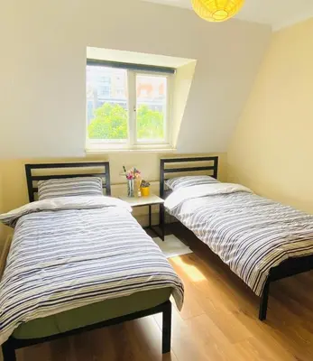 two beds sitting next to each other in a room at The class omote in Tokyo